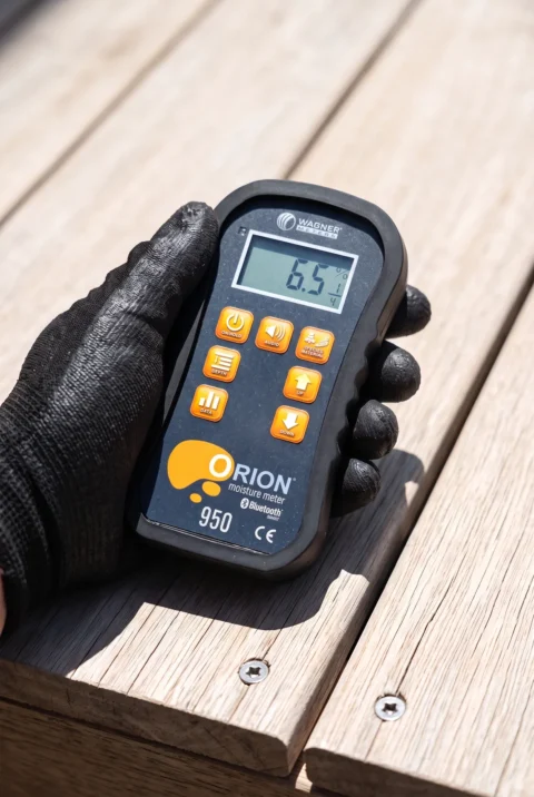 Checking timber with a moisture meter